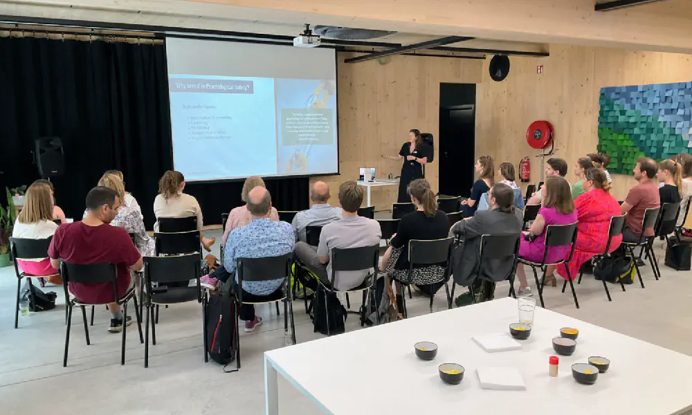 A picture showing the event 'Breaking the Silos: Psychological Safety in Tech' taking place.